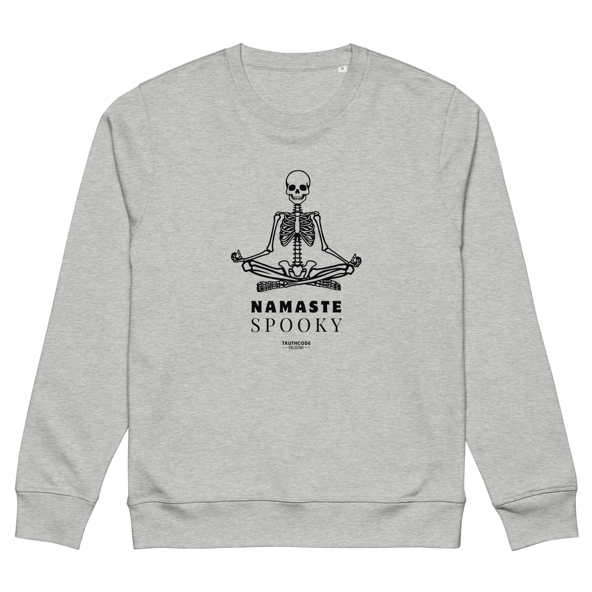 Gray organic sweatshirt with a skeleton design and 'Namaste Spooky' text on a white background