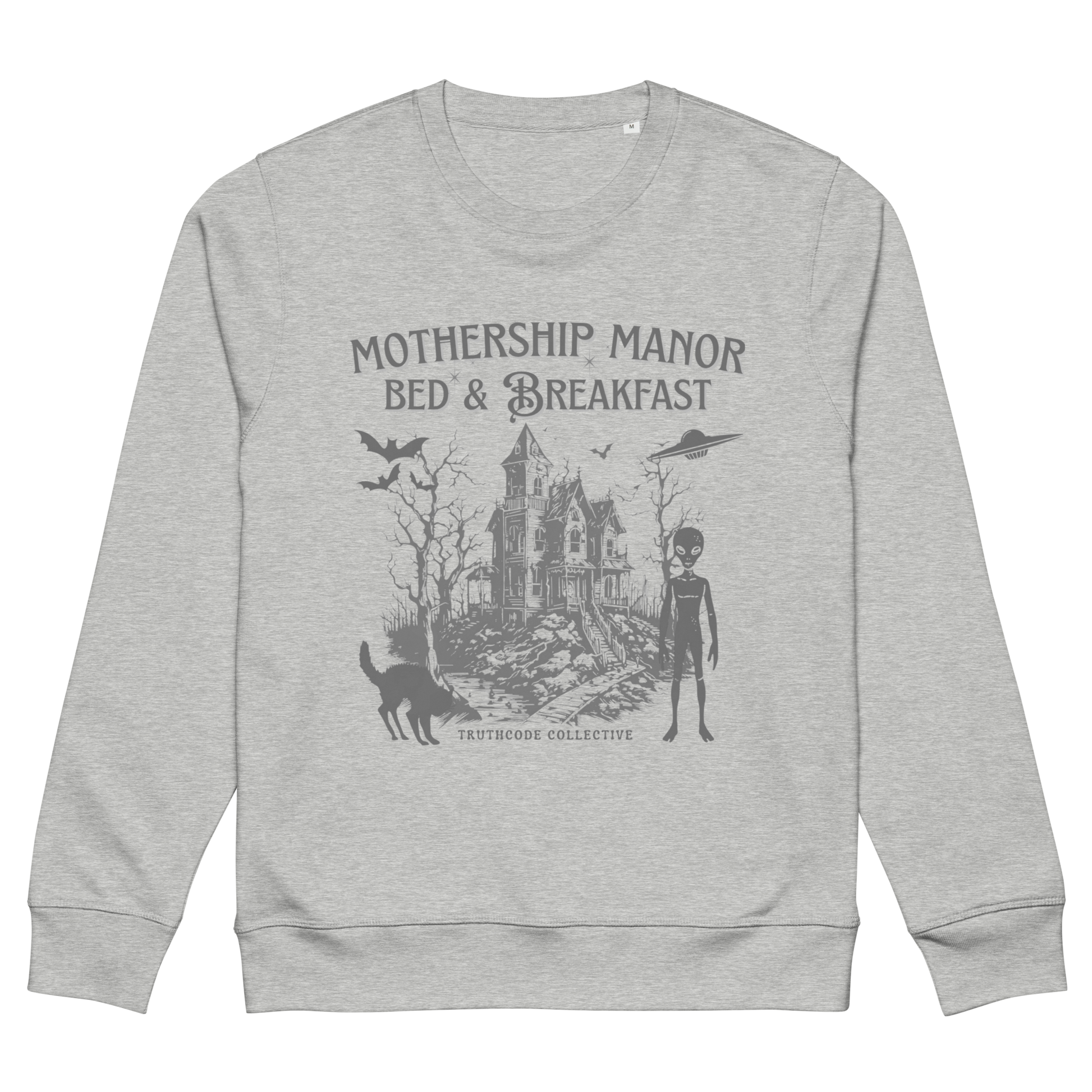 Gray organic sweatshirt with a graphic design of a haunted house, alien, and spaceship, with text 'Mothership Manor Bed & Breakfast' on a white background