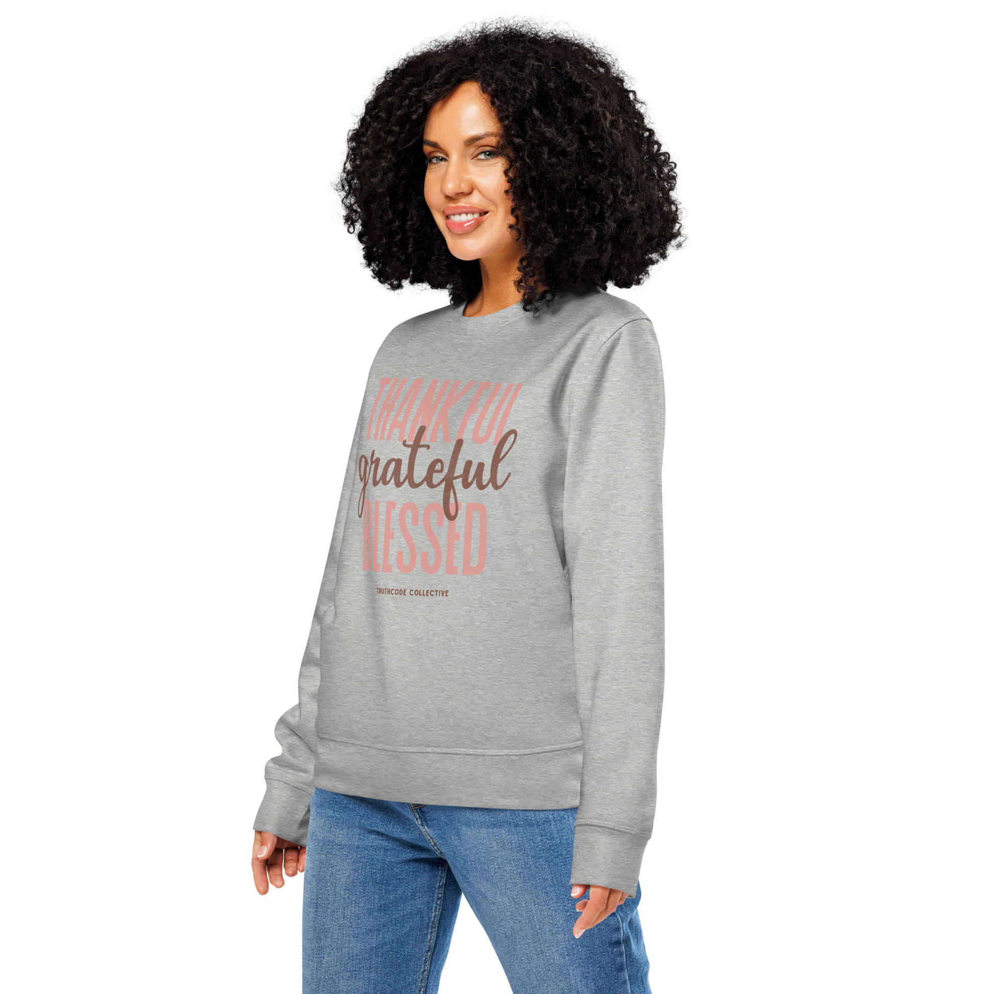 Woman wearing gray organic sweatshirt with 'Thankful grateful BLESSED' text design on a white background