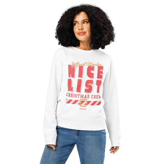 Woman wearing white organic sweatshirt with text 'Official member, nice list Christmas crew' with a holiday belt graphic on a white background