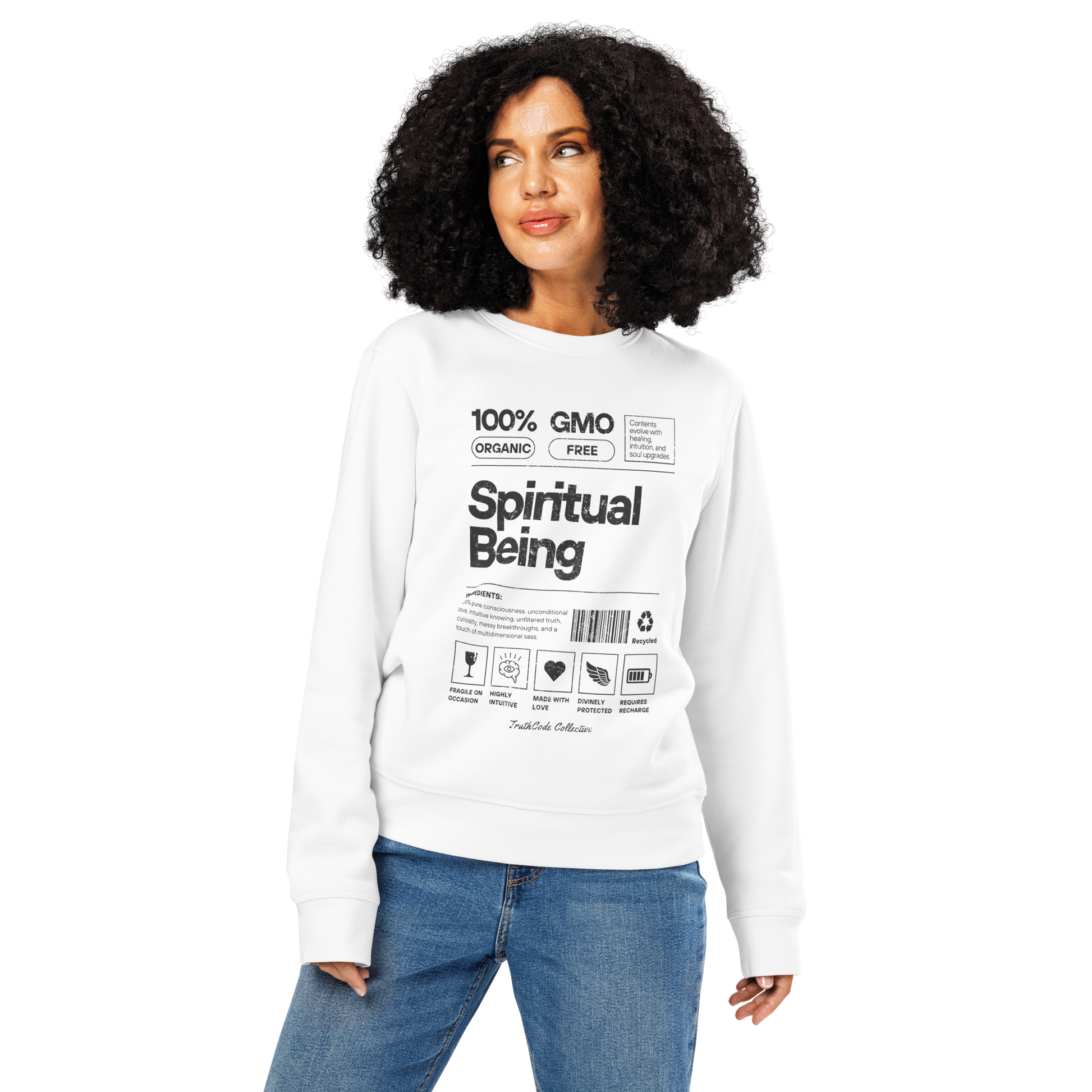 Woman wearing white organic sweatshirt with text 'Spiritual being' and graphics resembling a laundry tag on a white background