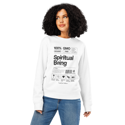 Woman wearing white organic sweatshirt with text 'Spiritual being' and graphics resembling a laundry tag on a white background
