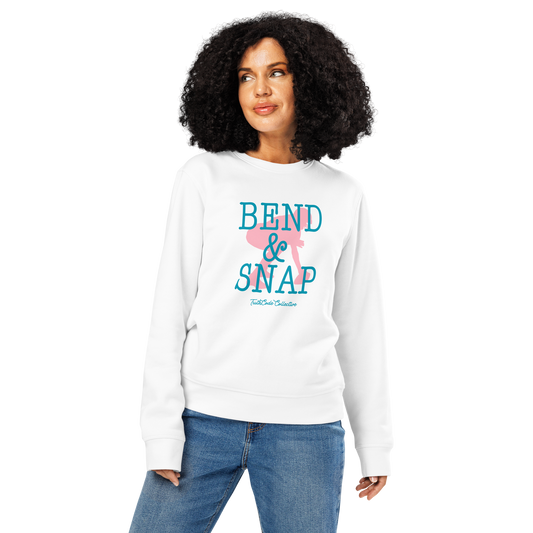Woman wearing white organic sweatshirt with 'Bend & Snap' text and graphic design of football center ready to snap the ball, on a white background