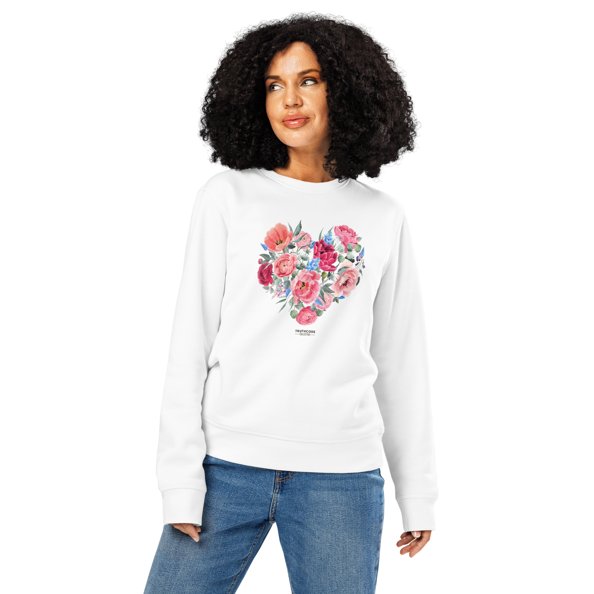 Woman wearing white organic sweatshirt with a floral heart design on a white background