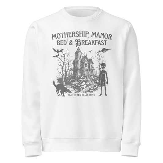 White organic sweatshirt with a graphic design of a haunted house and spaceship and text 'Mothership manor bed & breakfast' on a white background