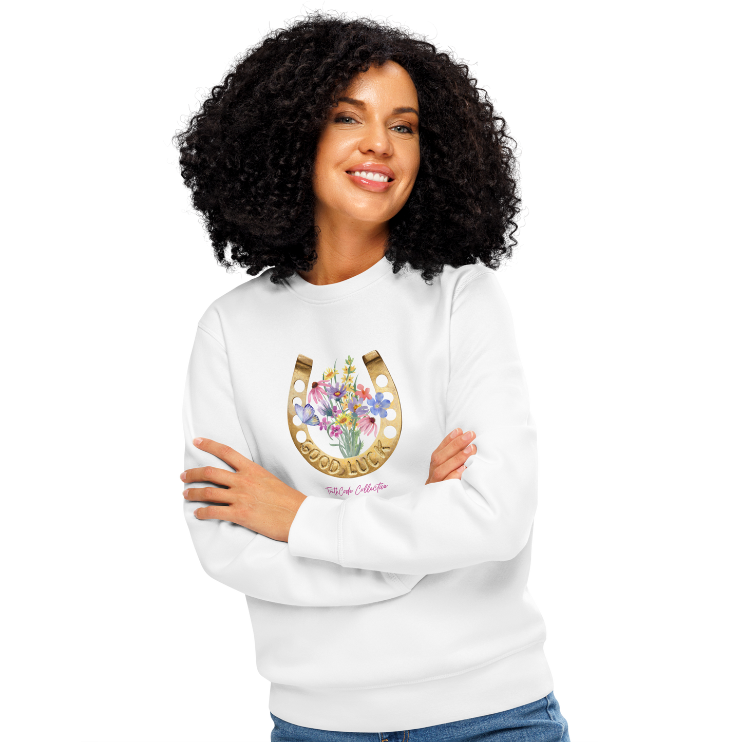 Woman wearing white organic sweatshirt with a floral and horseshoe design and text 'GOOD LUCK' on a white background