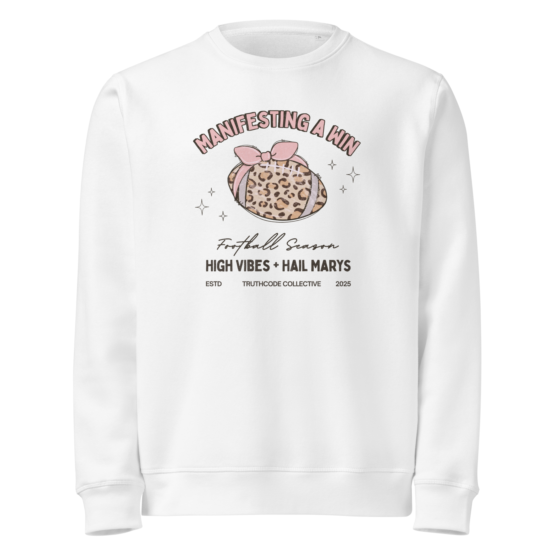 White organic sweatshirt with girly football graphic design and text 'Manifesting a win, high vibes + hail marys' on a white background