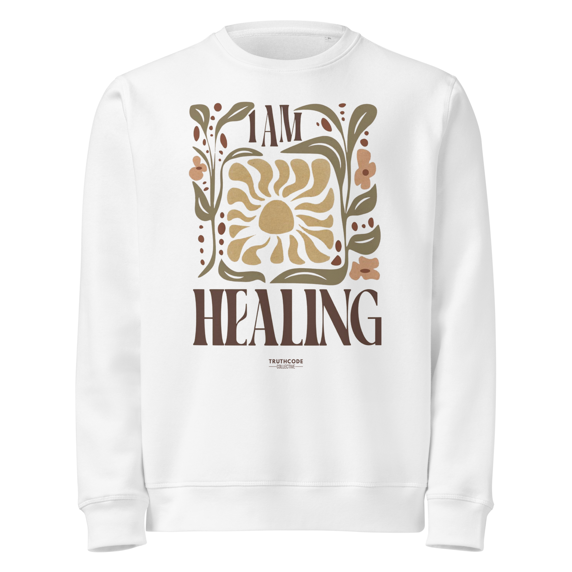 White organic sweatshirt with 'I AM HEALING' text and sun and plants design on a white background
