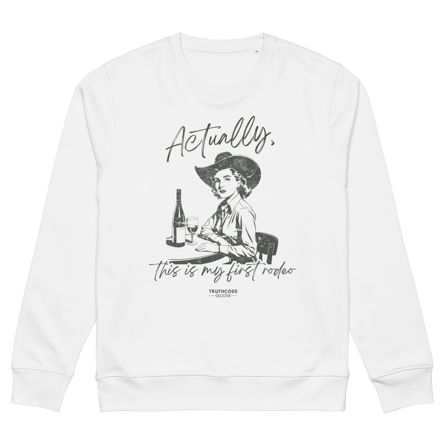 White organic sweatshirt with a vintage style graphic of a woman in a cowboy hat and text 'Actually, this is my first rodeo' on a white background