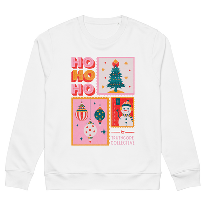 White sweatshirt with Christmas-themed design featuring 'HO HO HO', a tree, ornaments, and a snowman on a white background.