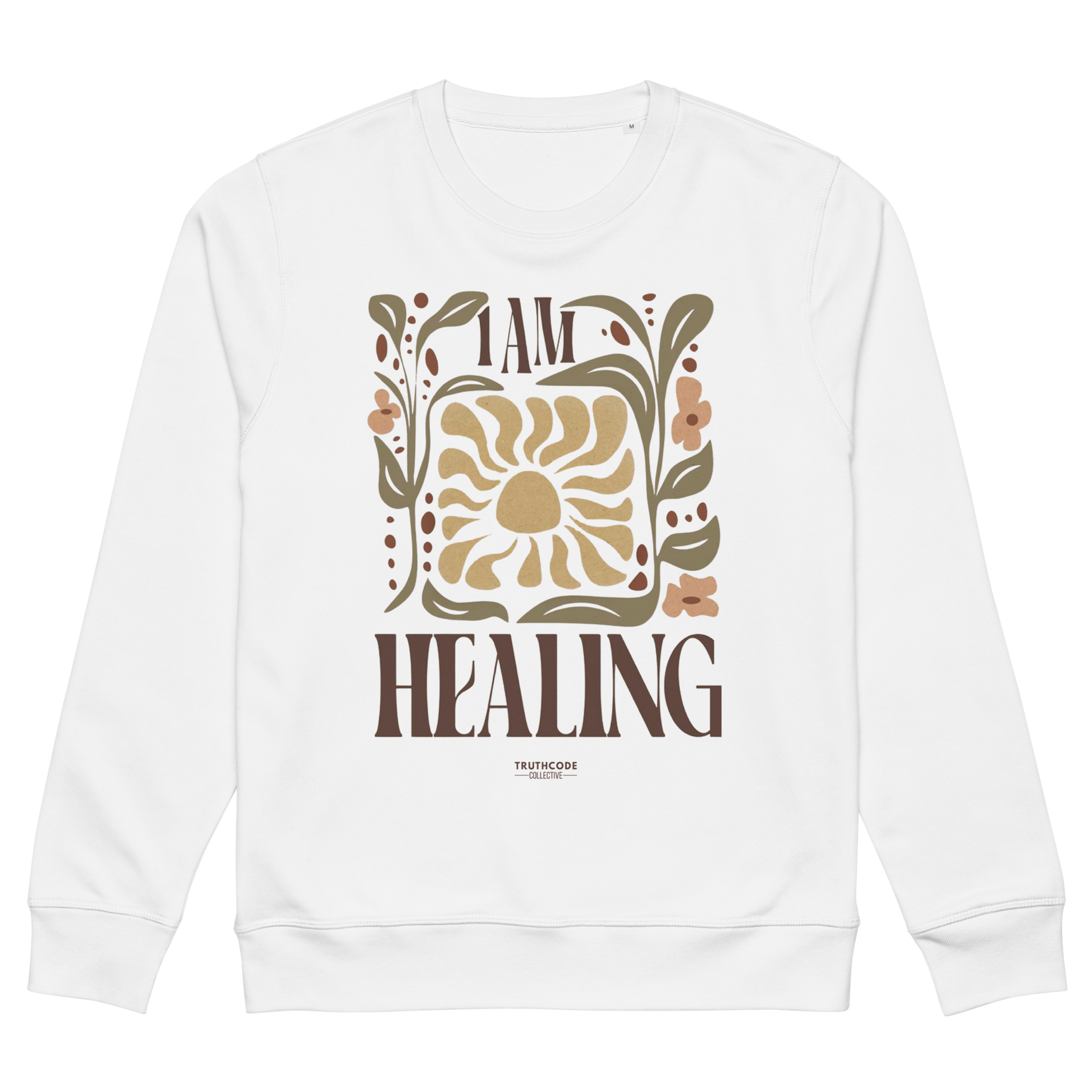 White organic sweatshirt with 'I AM HEALING' text and floral design on a white background