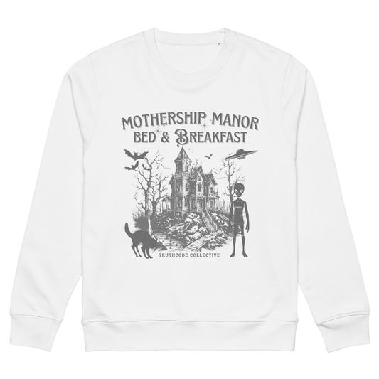 White organic sweatshirt with a graphic design of a haunted house, alien, and spaceship, with text 'Mothership Manor Bed & Breakfast' on a white background