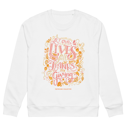 White organic sweatshirt with colorful text design 'Let our lives be full of both thanks and giving' on a white background