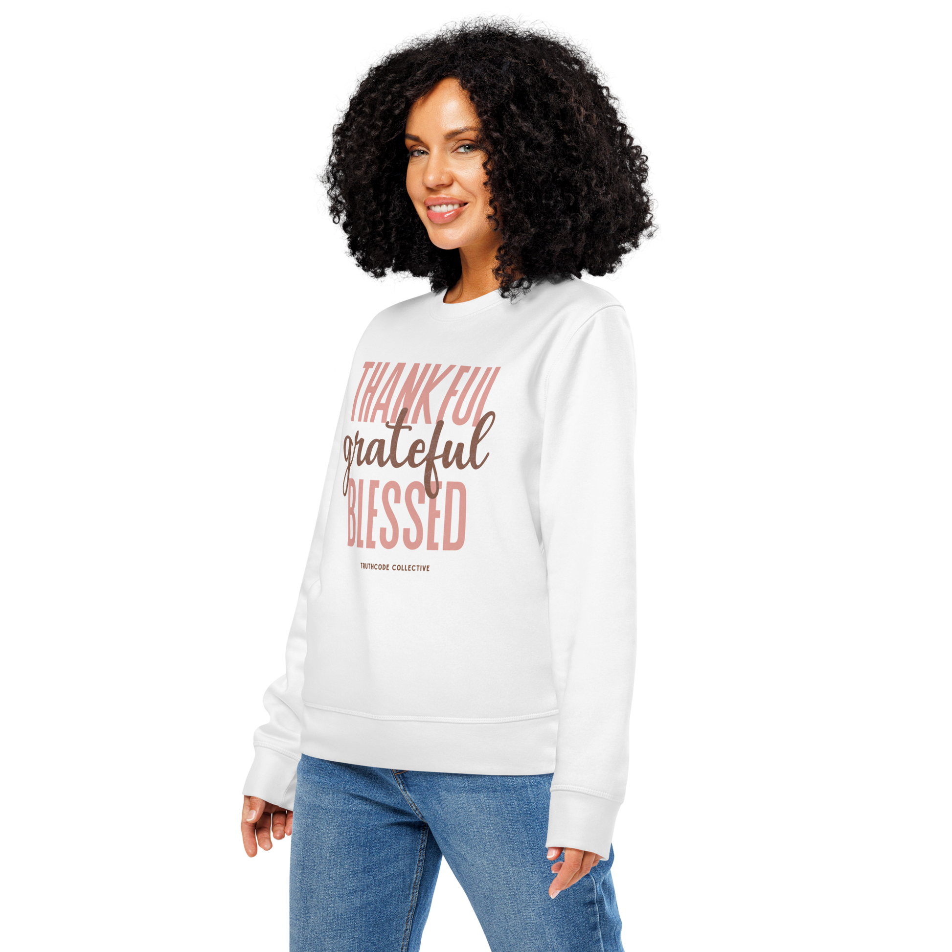 Woman wearing white organic sweatshirt with 'Thankful grateful BLESSED' text on a white background