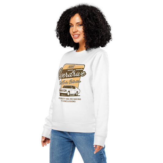 Woman wearing white organic sweatshirt with a vintage graphic design of a car and text 'Overdrive, my anxiety has me racing to conclusions' on a white background