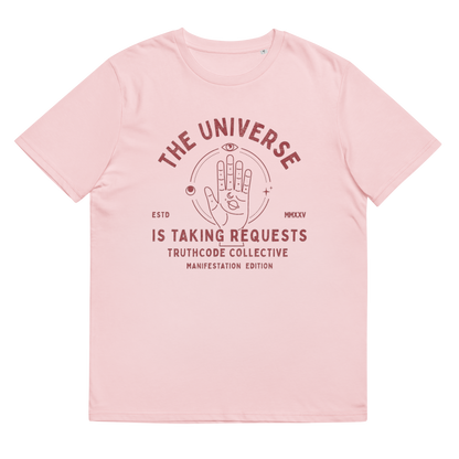 Pink organic t-shirt with graphic of a hand with symbols and text 'The universe is taking requests' against a white background