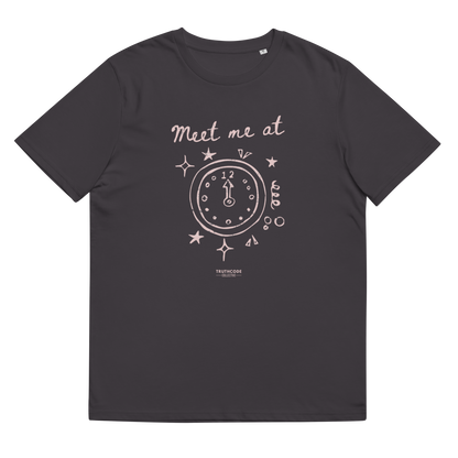 Dark gray organic t-shirt with a clock design and text 'Meet me at' and clock pointing to midnight, shirt on a white background