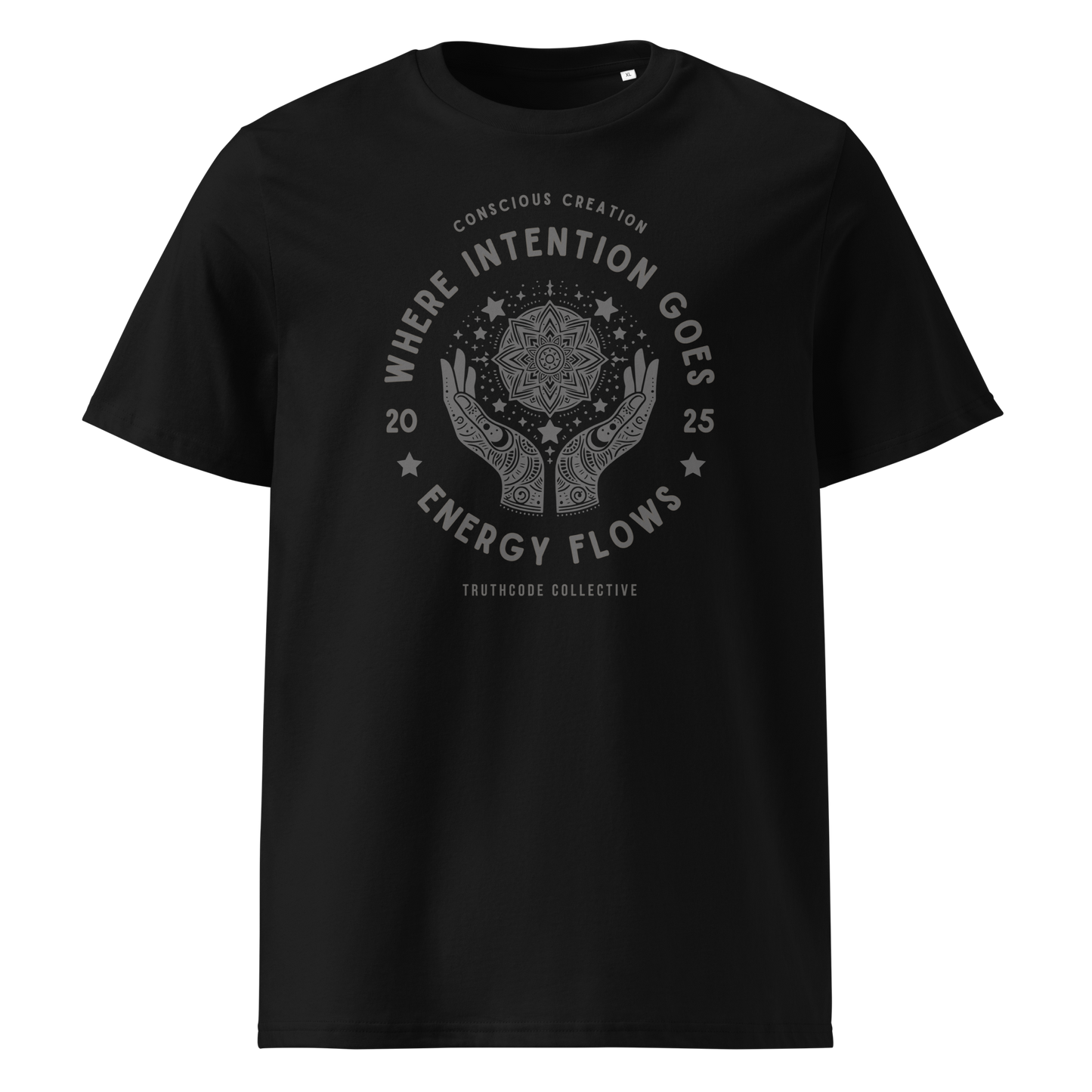 Black organic t- shirt with a graphic of hands and stars around a mandala symbol, with text reading 'Where intention goes, energy flows'