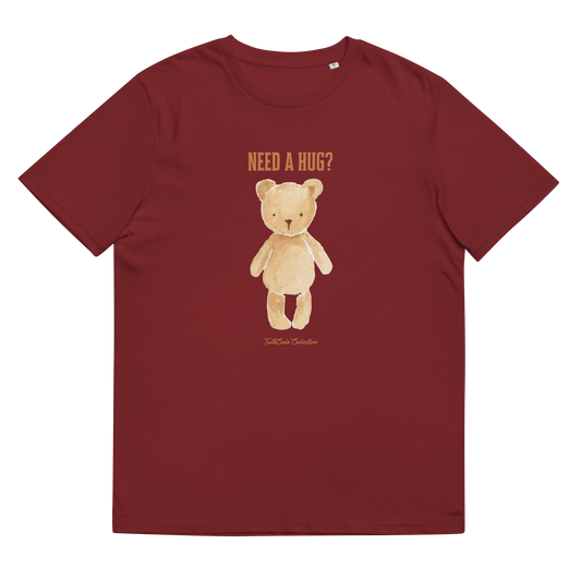 Burgundy organic t-shirt with a teddy bear graphic and text 'NEED A HUG?', shirt on a white background