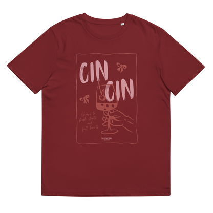 Burgundy organic t-shirt with text 'Cin Cin, cheers to fresh starts and full hearts' graphic design  of a glass, on a white background