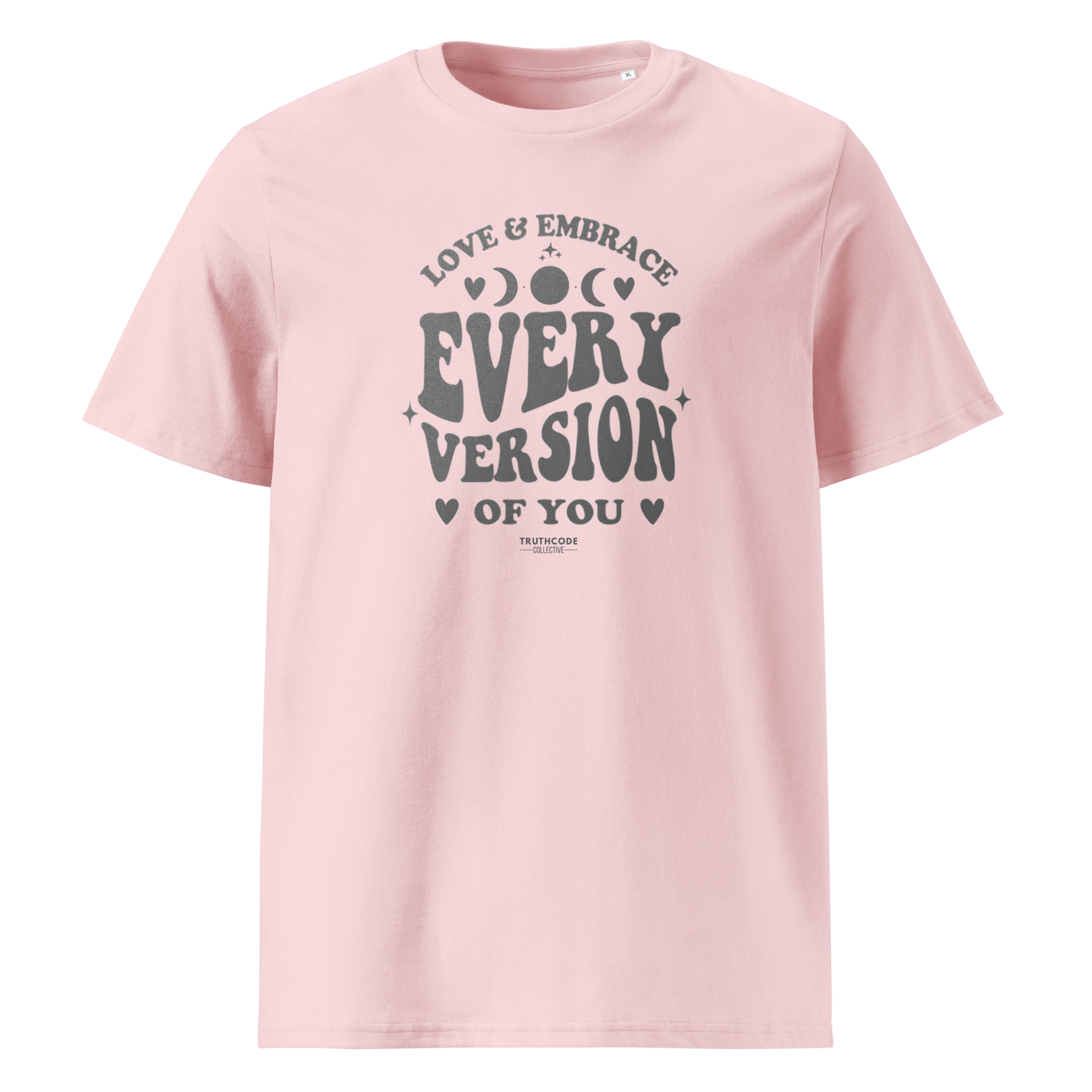 Pink organic t-shirt with motivational text 'Love & embrace every version of you' on a white background