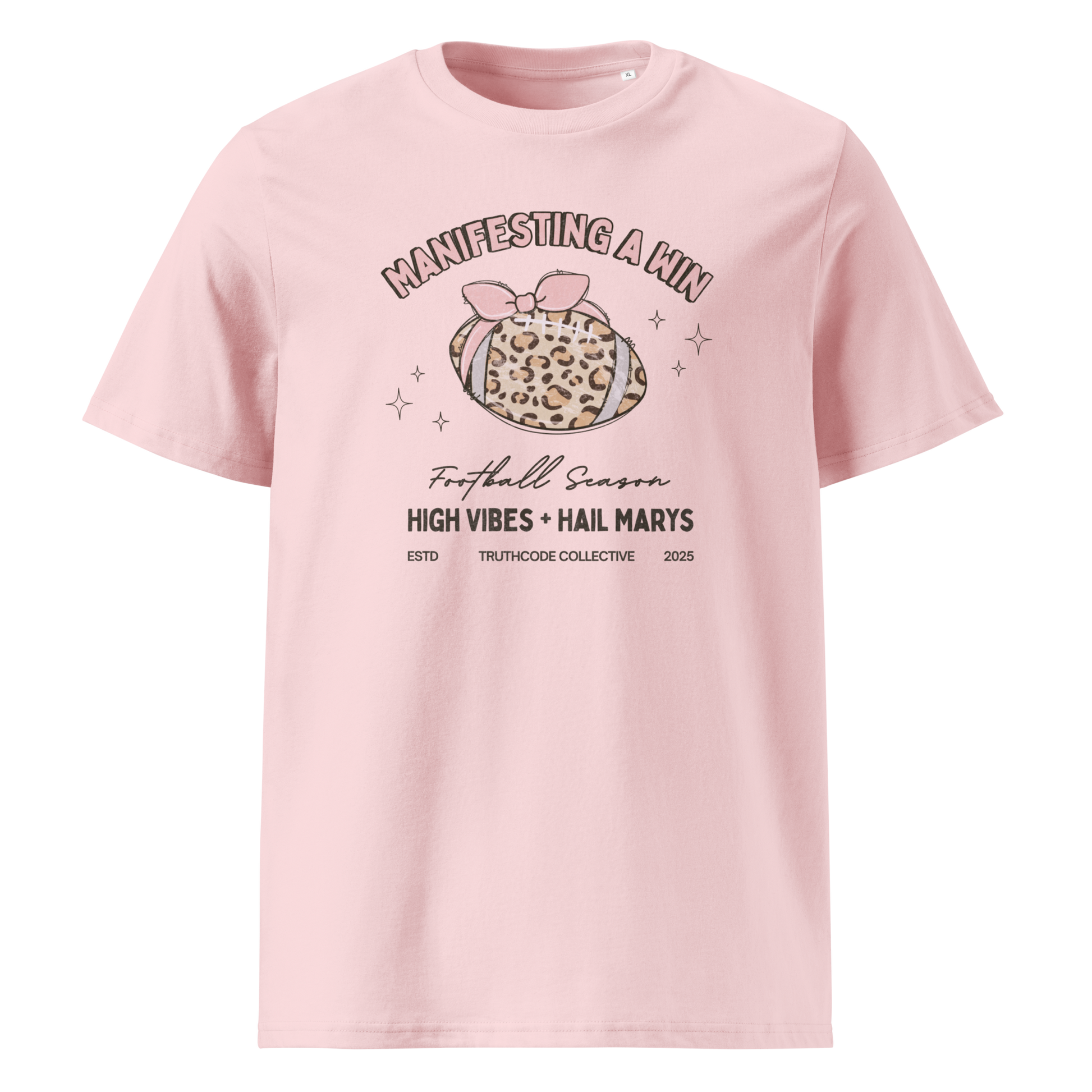 Pink organic t-shirt with girly football graphic and text 'Manifesting a win' and 'Football season, high vibes and hail marys' on a white background