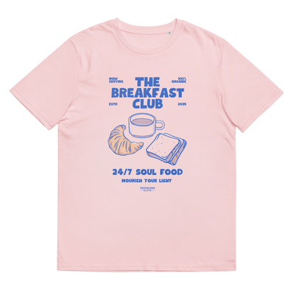 Pink organic t-shirt with 'The Breakfast Club' graphic design featuring a coffee cup, croissant, and sandwich.