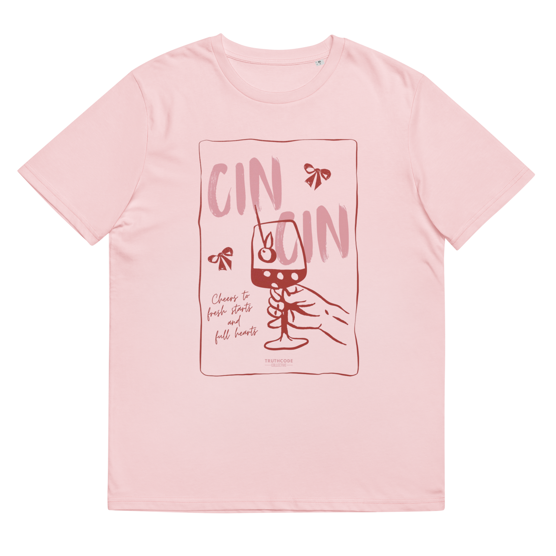 Pink organic t-shirt with text 'Cin Cin, cheers to fresh starts and full hearts' graphic design  of a glass, on a white background