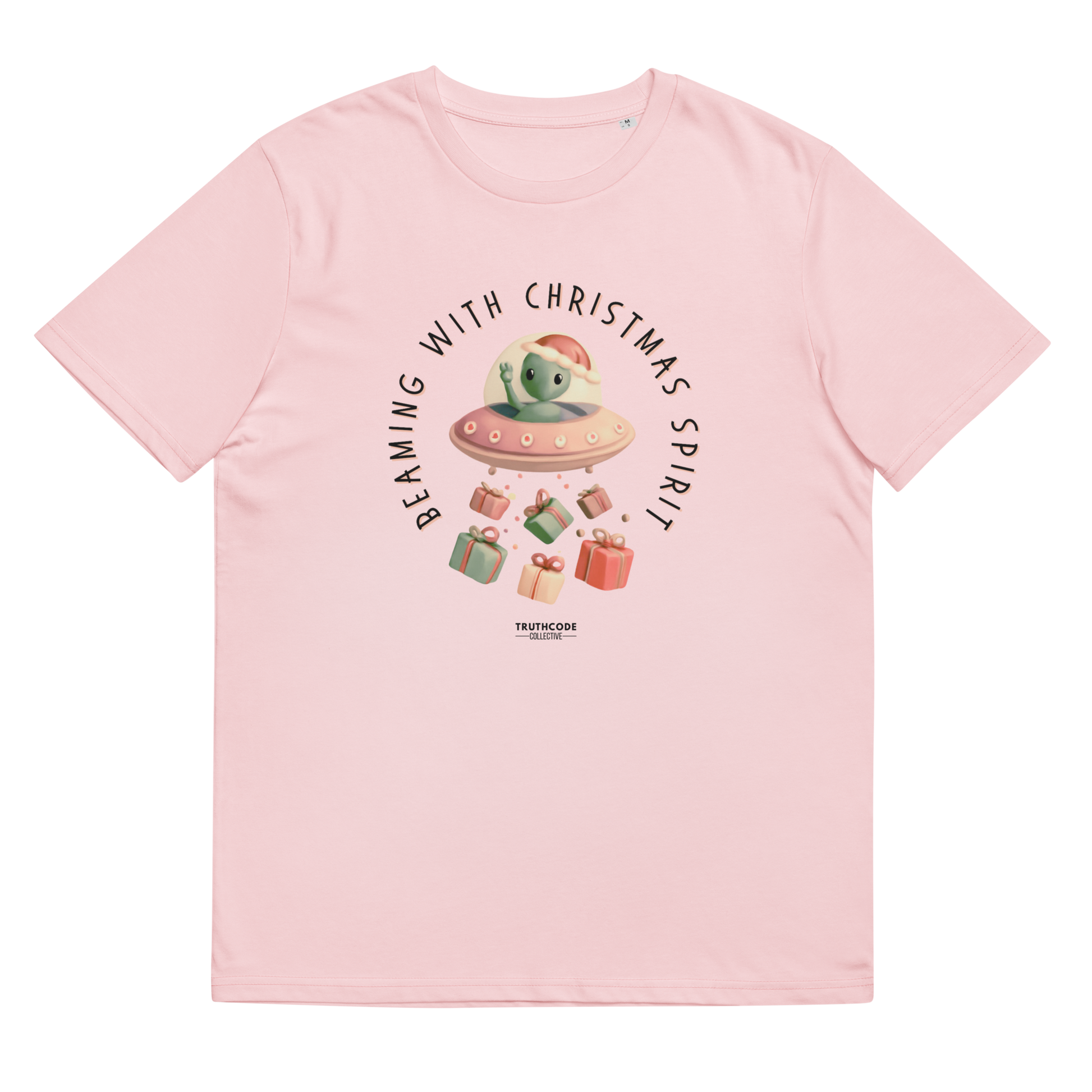 Pink organic t-shirt with cute alien in a spaceship Christmas-themed graphic and text 'Beaming with Christmas spirit'