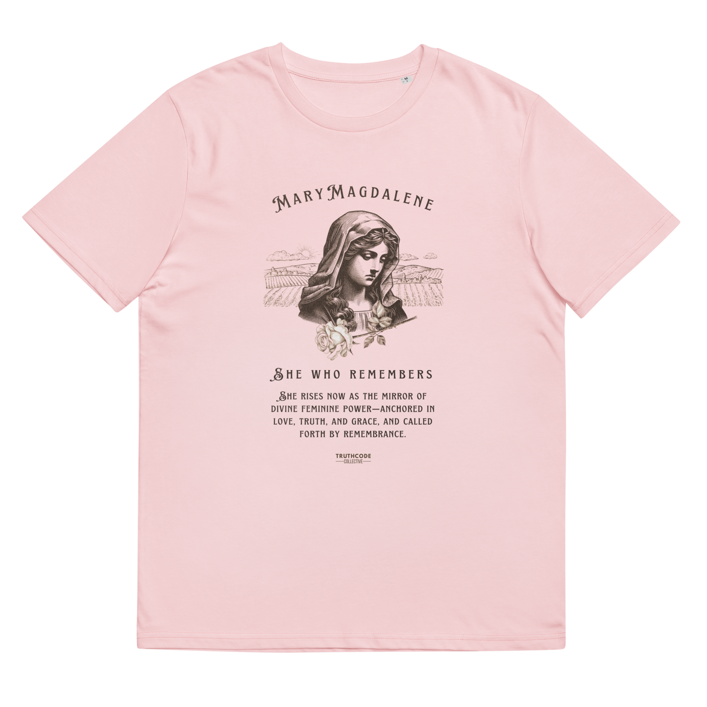 Pink organic t-shirt with a graphic of Mary Magdalene and text 'She who remembers, she rises now as the mirror of the divine feminine power...',  on a white background