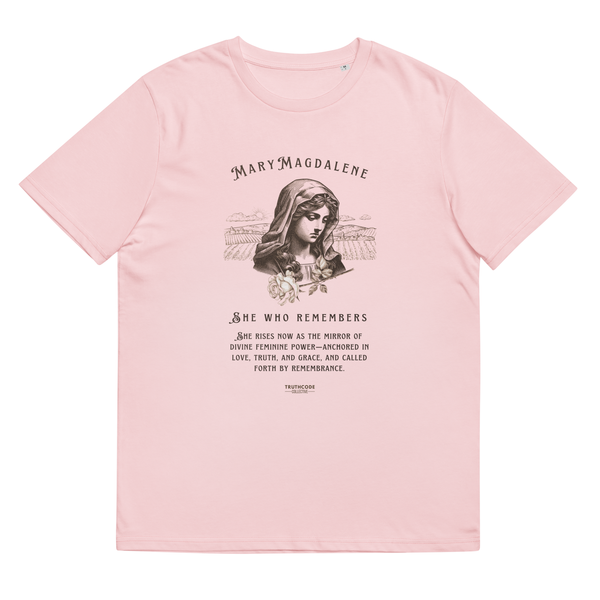 Pink organic t-shirt with a graphic of Mary Magdalene and text 'She who remembers, she rises now as the mirror of the divine feminine power...',  on a white background