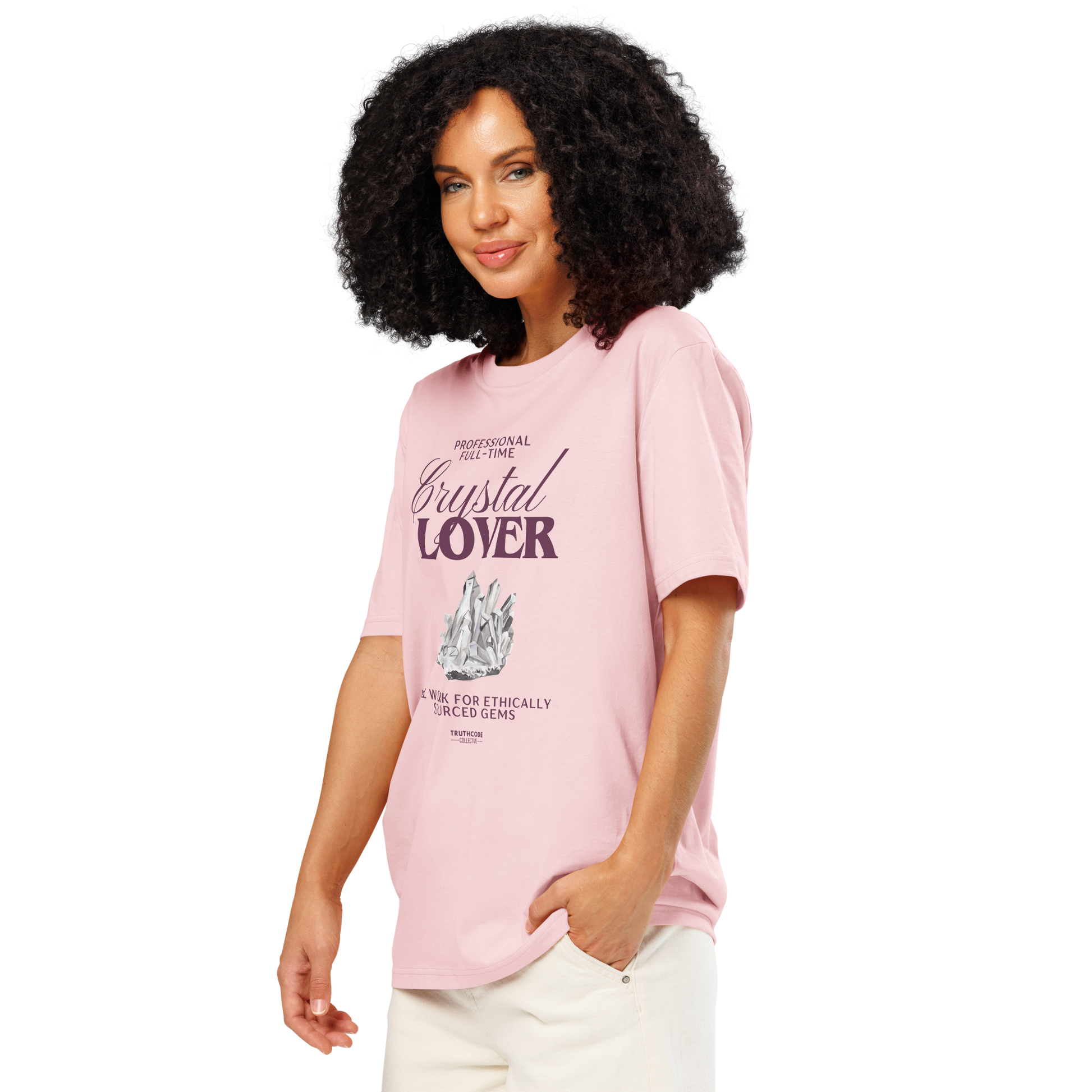 Woman wearing pink organic t-shirt with crystal graphic and text saying 'Crystal Lover, will work for ethically sourced gems' 
