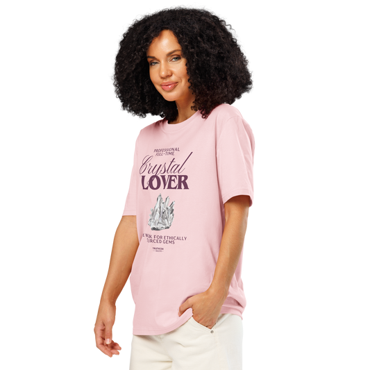 Woman wearing pink organic t-shirt with crystal graphic and text saying 'Crystal Lover, will work for ethically sourced gems' 