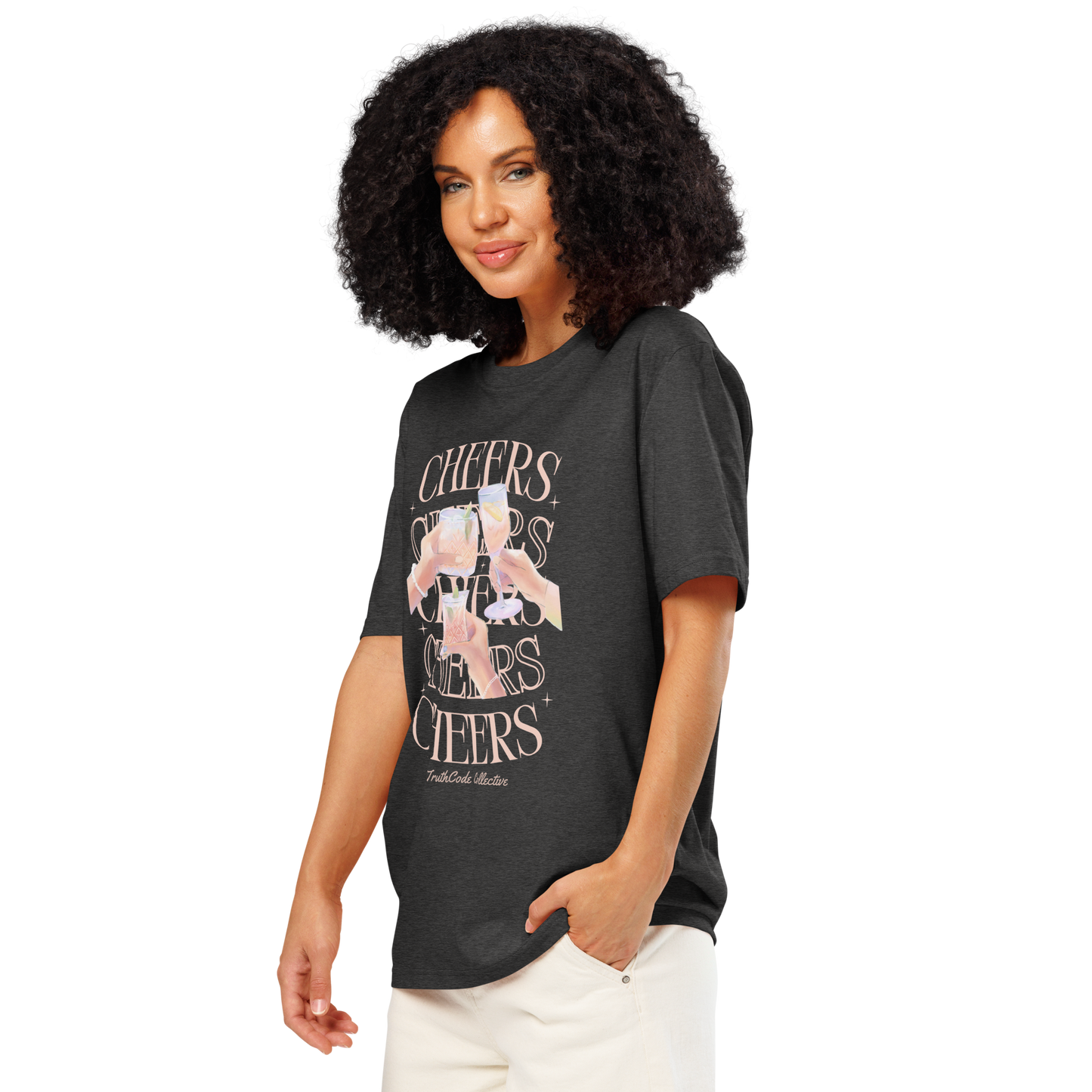 Woman wearing dark gray organic t-shirt with 'Cheers' text and graphic design of hands clinking glasses on a white background