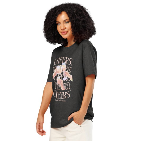Woman wearing dark gray organic t-shirt with 'Cheers' text and graphic design of hands clinking glasses on a white background