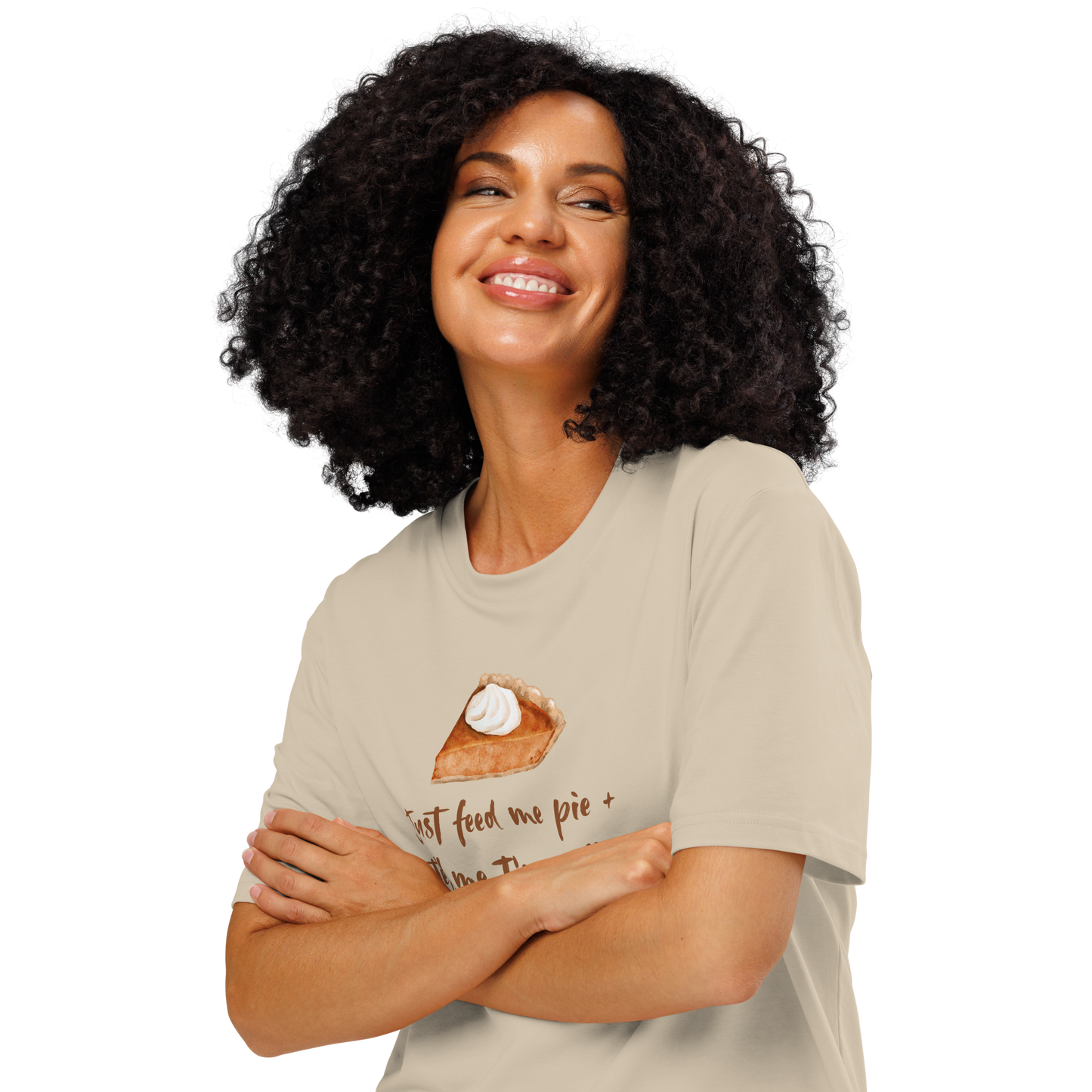 Woman wearing beige organic t-shirt with a pie graphic and text 'Just feed me pie + tell me I'm pretty'