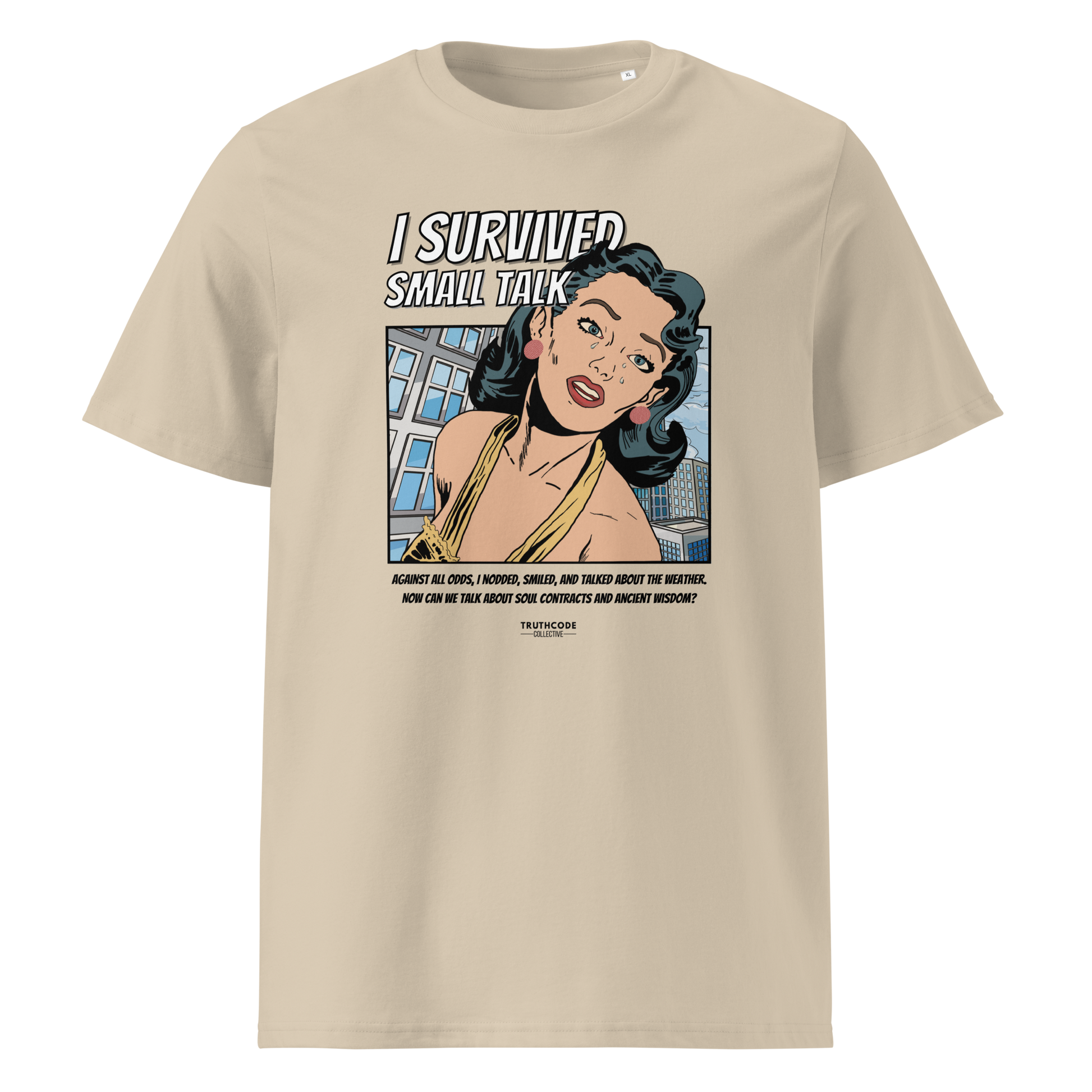 Beige organic t-shirt with a graphic design featuring a comic cartoon woman and text with lighthearted saying 'I SURVIVED SMALL TALK' on a white background