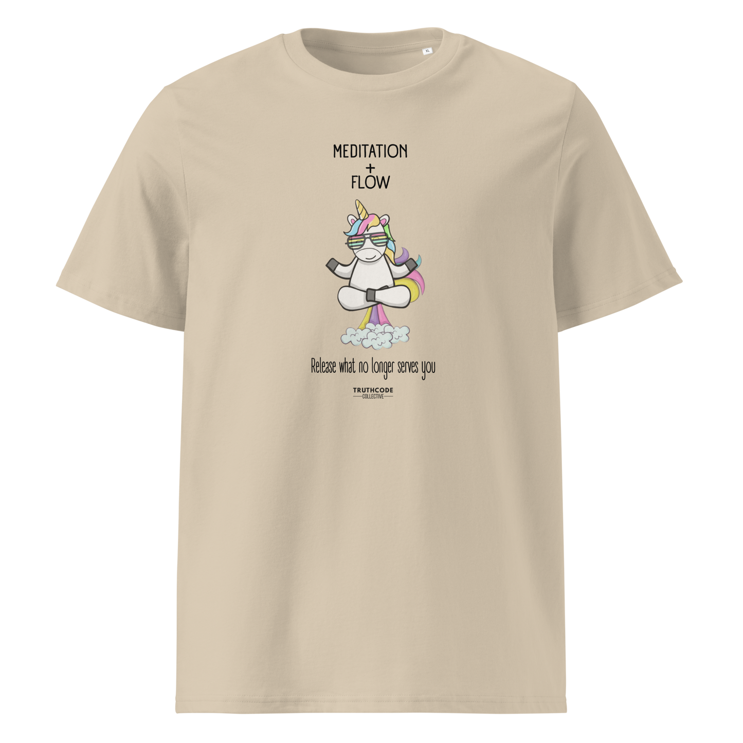 Beige organic t-shirt with a humorous farting unicorn graphic and text reading 'Meditation + Flow, release what no longer serves you' on a white background