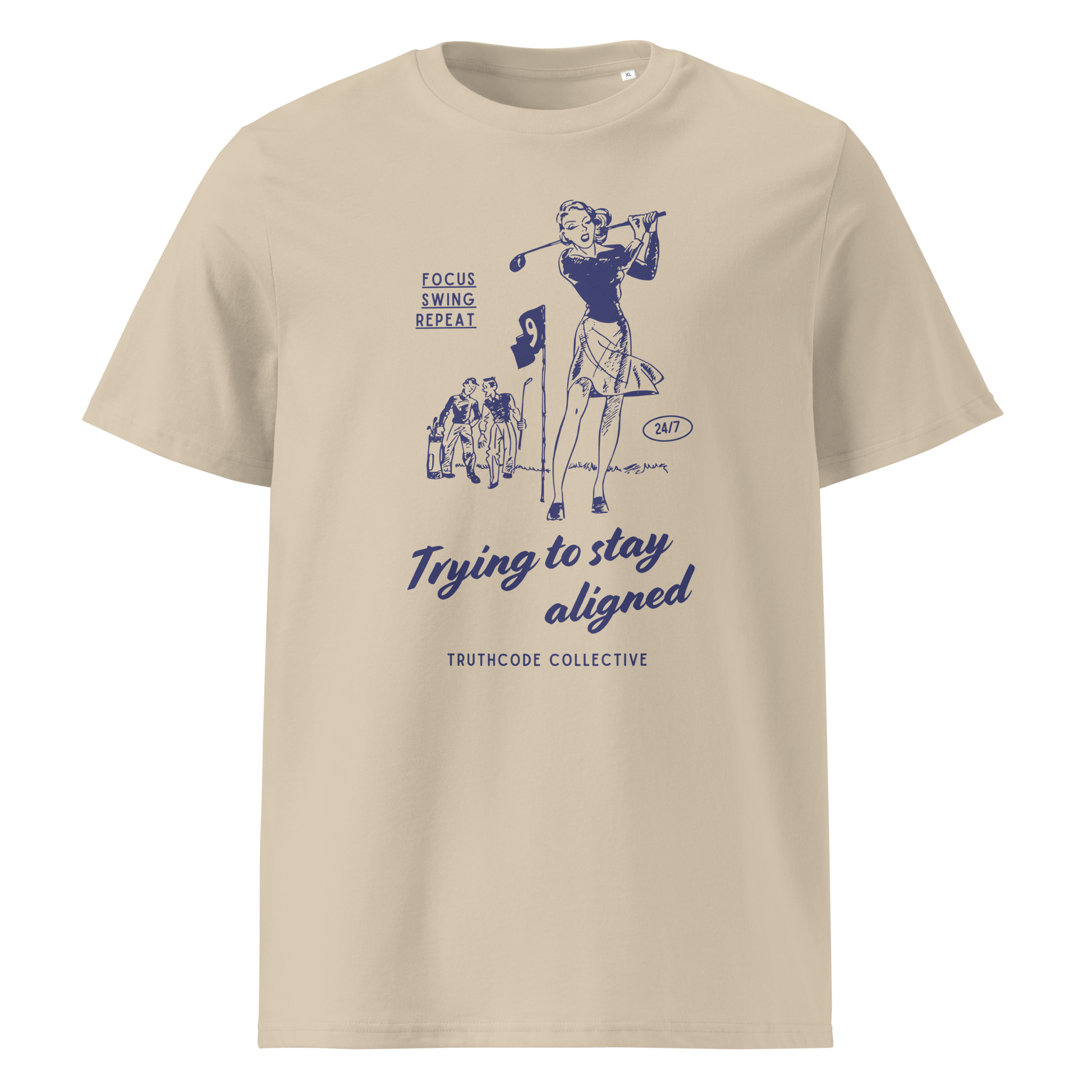 Beige organic t-shirt with blue vintage graphic of a woman golfing and text 'Trying to stay aligned' and 'Focus, swing, repeat' on a white background