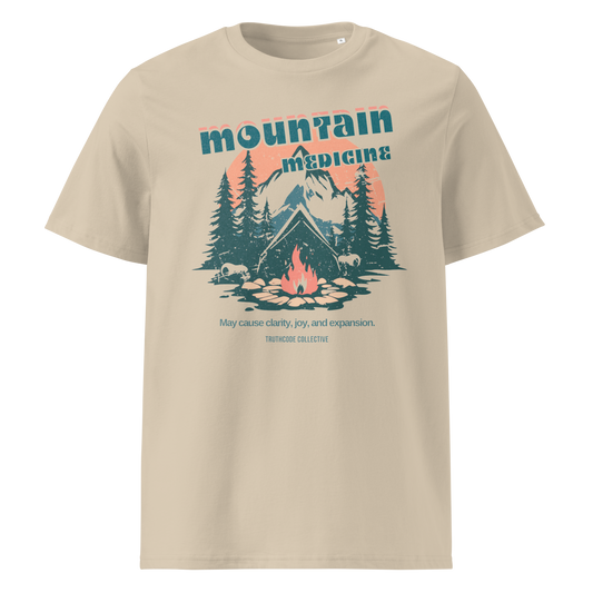 Beige organic t-shirt with mountain and campfire graphic and 'Mountain Medicine' text on a white background