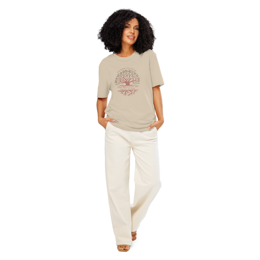 Woman wearing beige organic t-shirt with a tree design and text 'Your ancestors are proud of you' on a white background