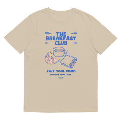 Beige organic t-shirt with 'The Breakfast Club' graphic design featuring a coffee cup, croissant, and sandwich.