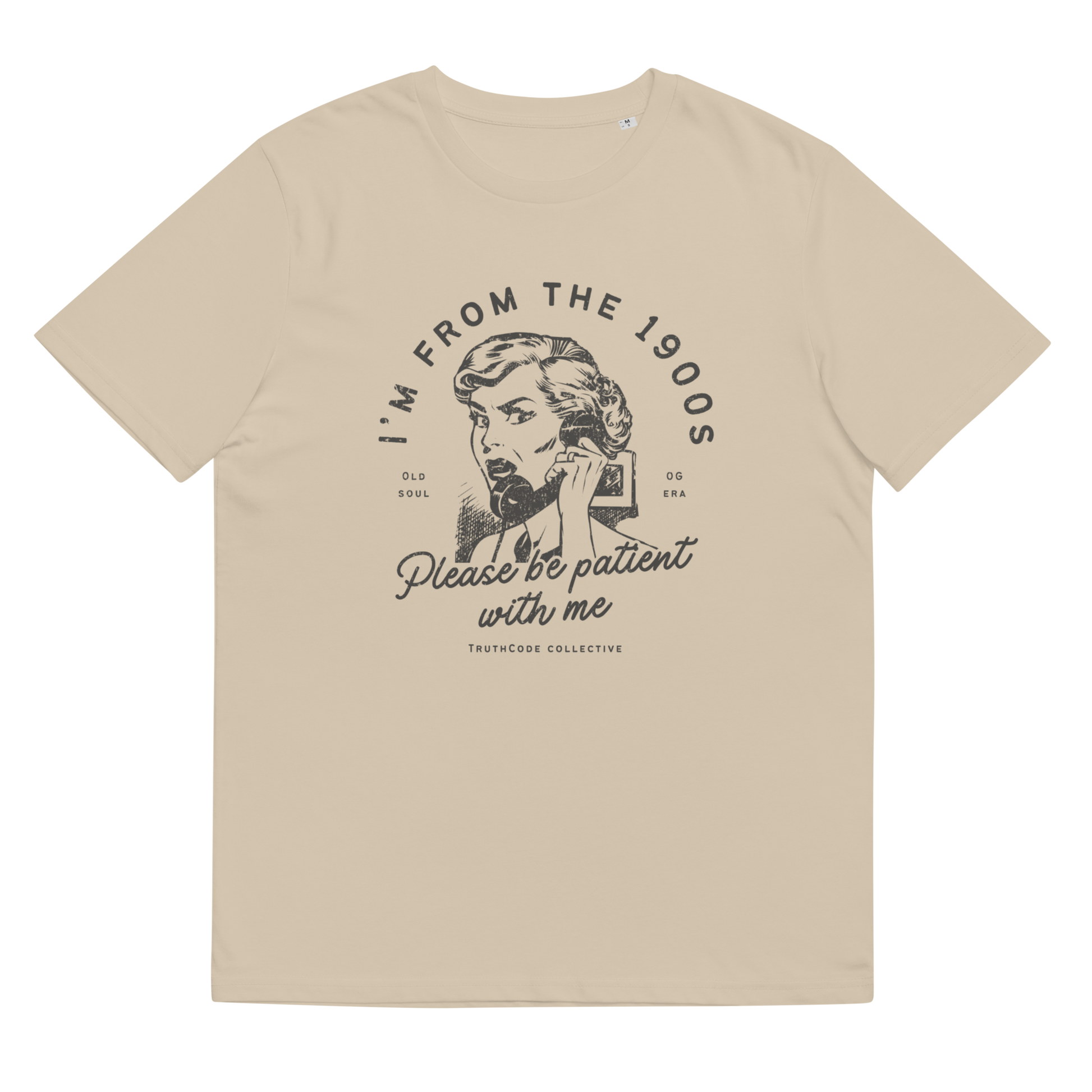 Beige organic t-shirt with vintage style graphic design of woman on the phone and text 'I'm from the 1900's, please be patient with me' on a white background