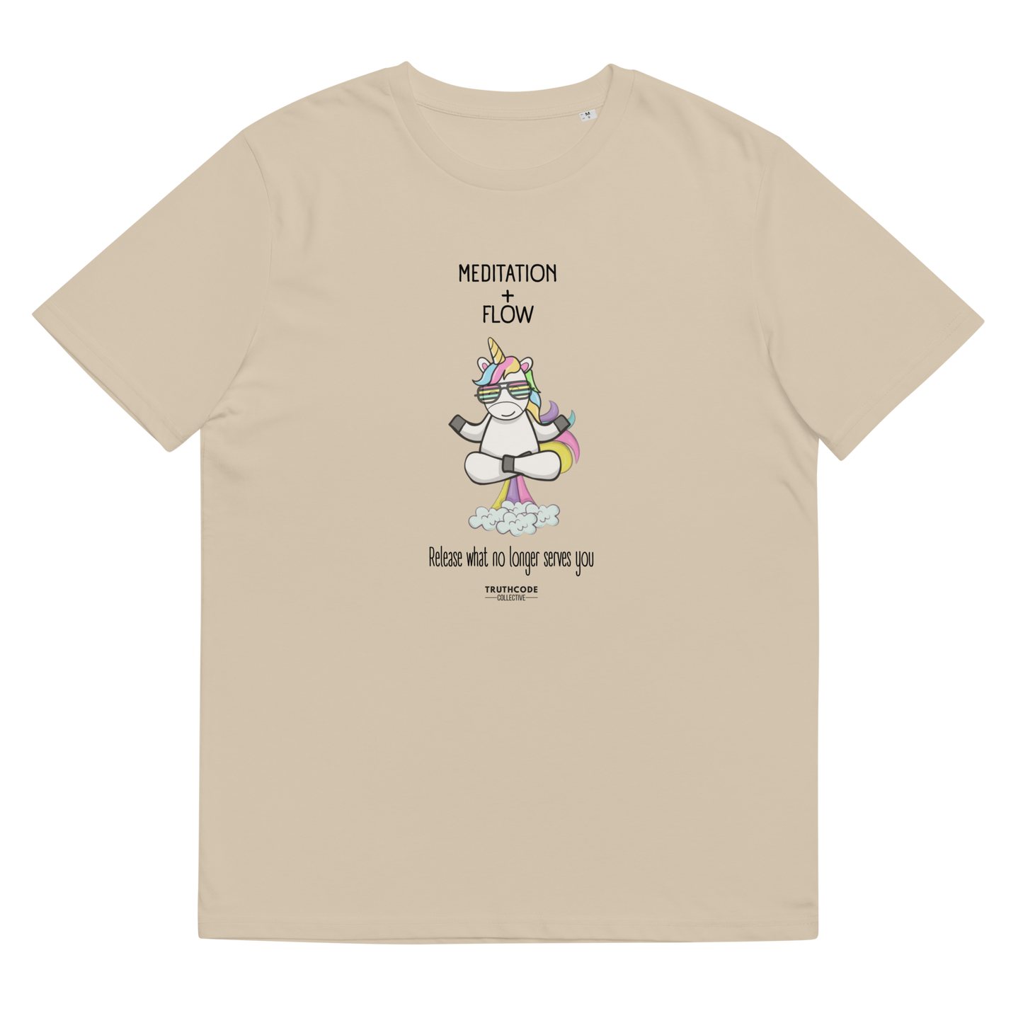 Beige organic t-shirt with a unicorn farting a rainbow graphic and text 'Meditation + Flow, release what no longer serves you' on a white background