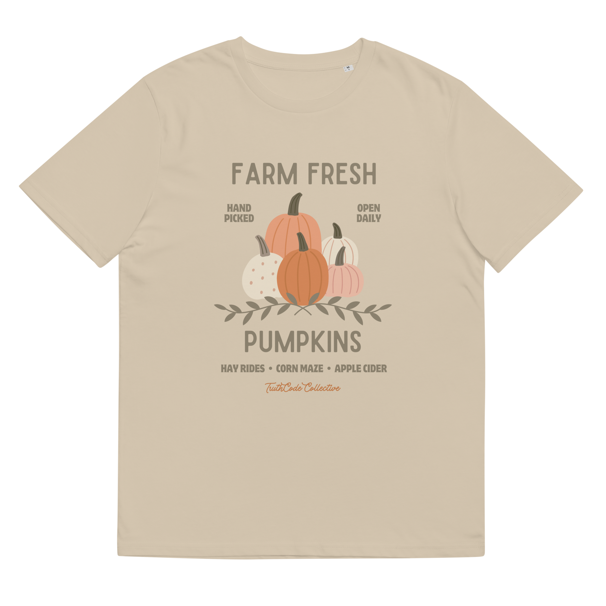 Beige organic t-shirt with pumpkin graphic and text 'Farm fresh pumpkins, hay rides, corn maze, apple cider'  on a white background