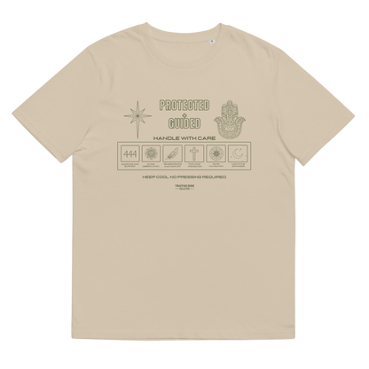 Beige organic t-shirt with 'Protected + Guided' text and laundry tag style graphic design with elements relating to protection on a white background