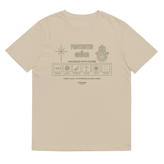 Beige organic t-shirt with 'Protected + Guided' text and laundry tag style graphic design with elements relating to protection on a white background