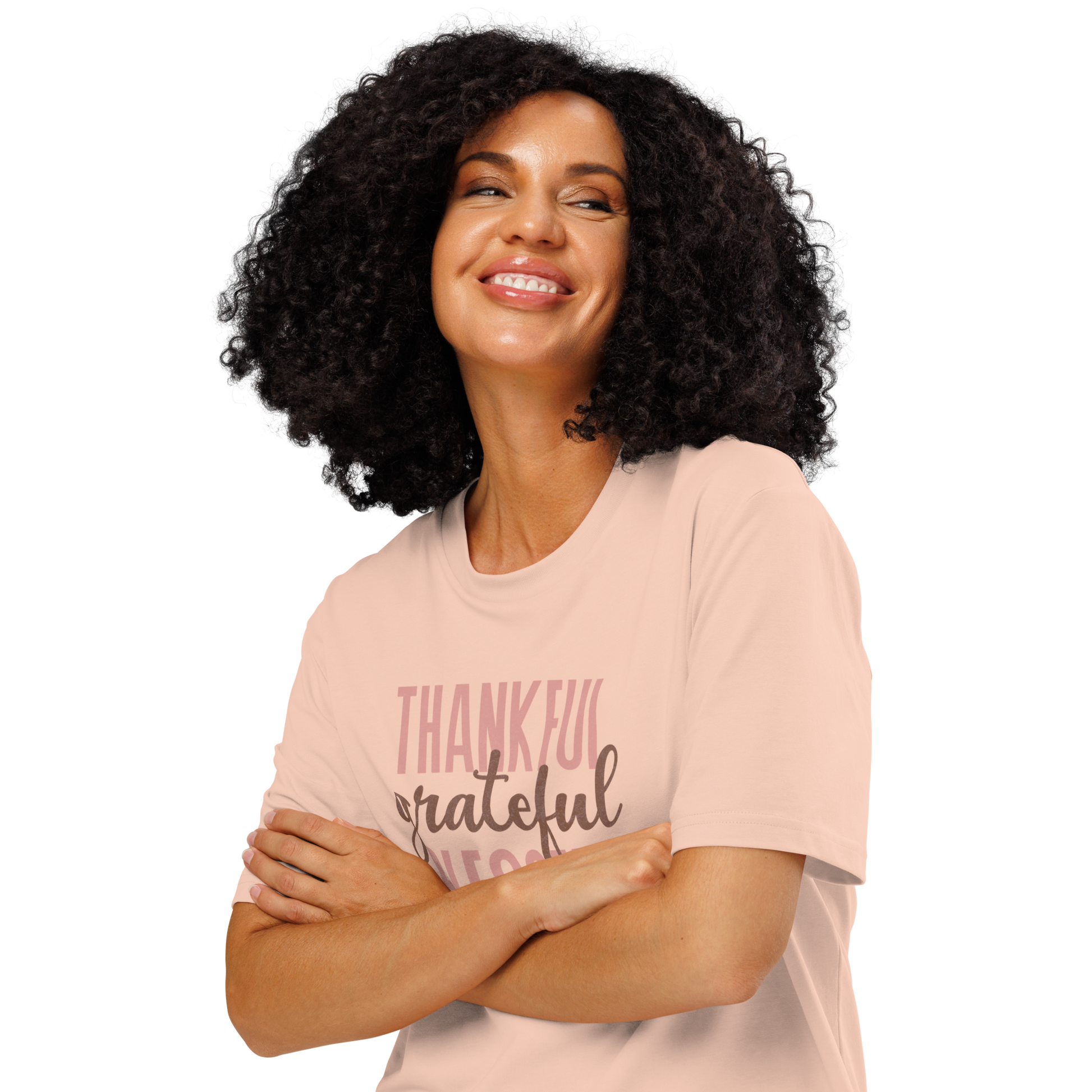 Woman wearing peach organic t-shirt with 'Thankful grateful BLESSED' text design on a white background