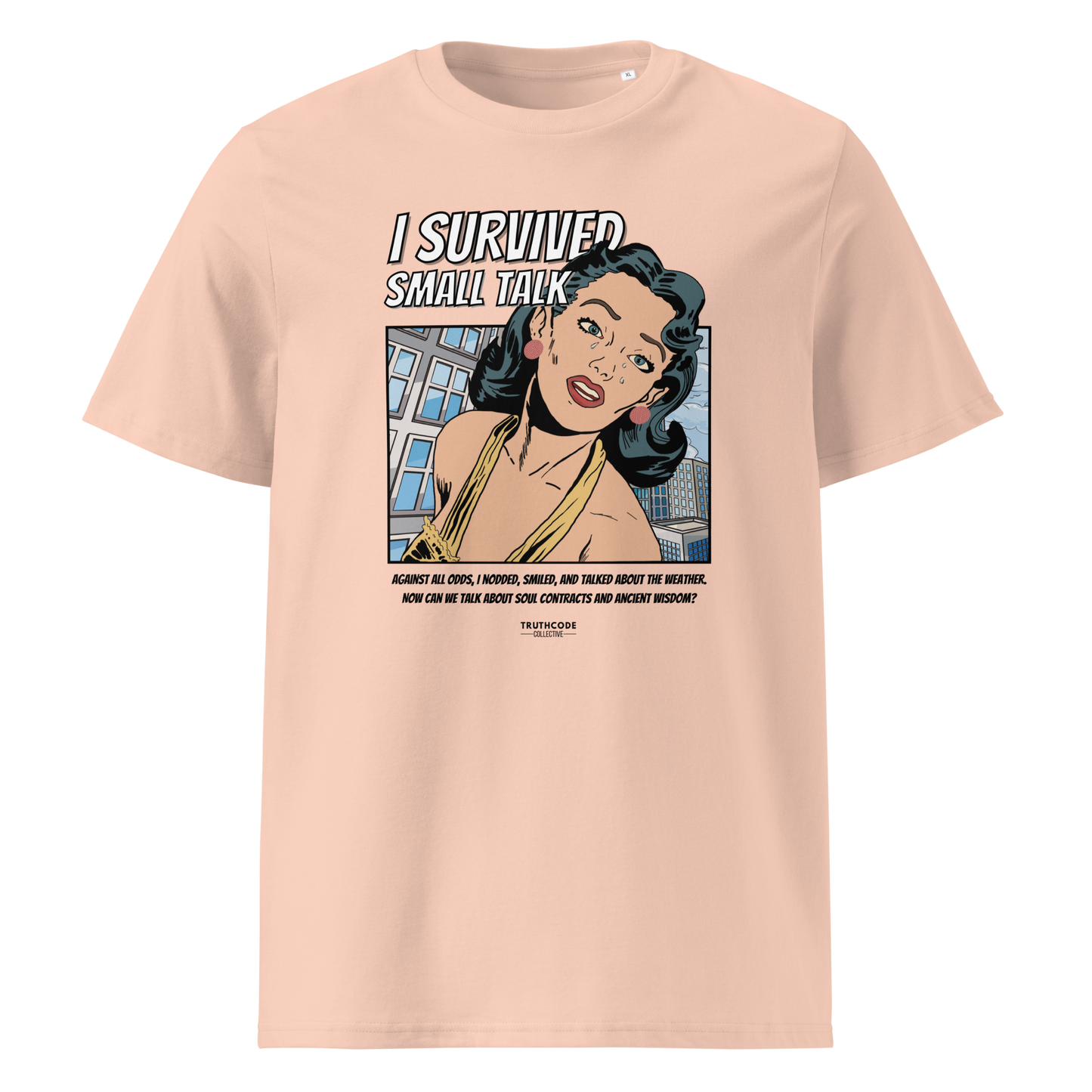 Peach organic t-shirt with a graphic design featuring a comic cartoon woman and text with lighthearted saying 'I SURVIVED SMALL TALK'