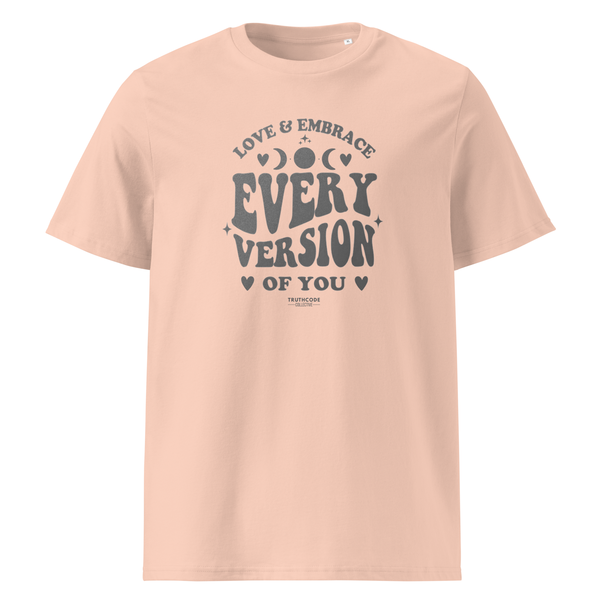 Peach organic t-shirt with motivational text 'Love & embrace every version of you' on a white background